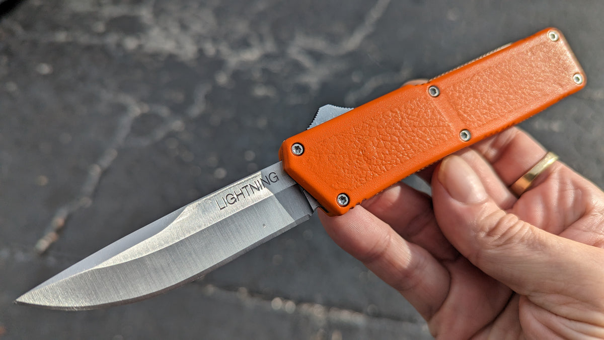 ORANGE LIGHTNING OTF KNIFE PLAIN EDGE DROP POINT BLADE
