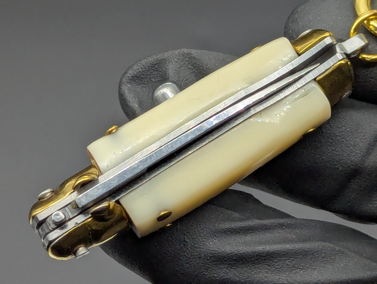 MINI JUMBO FAUX IVORY SWITCHBLADE KEYRING