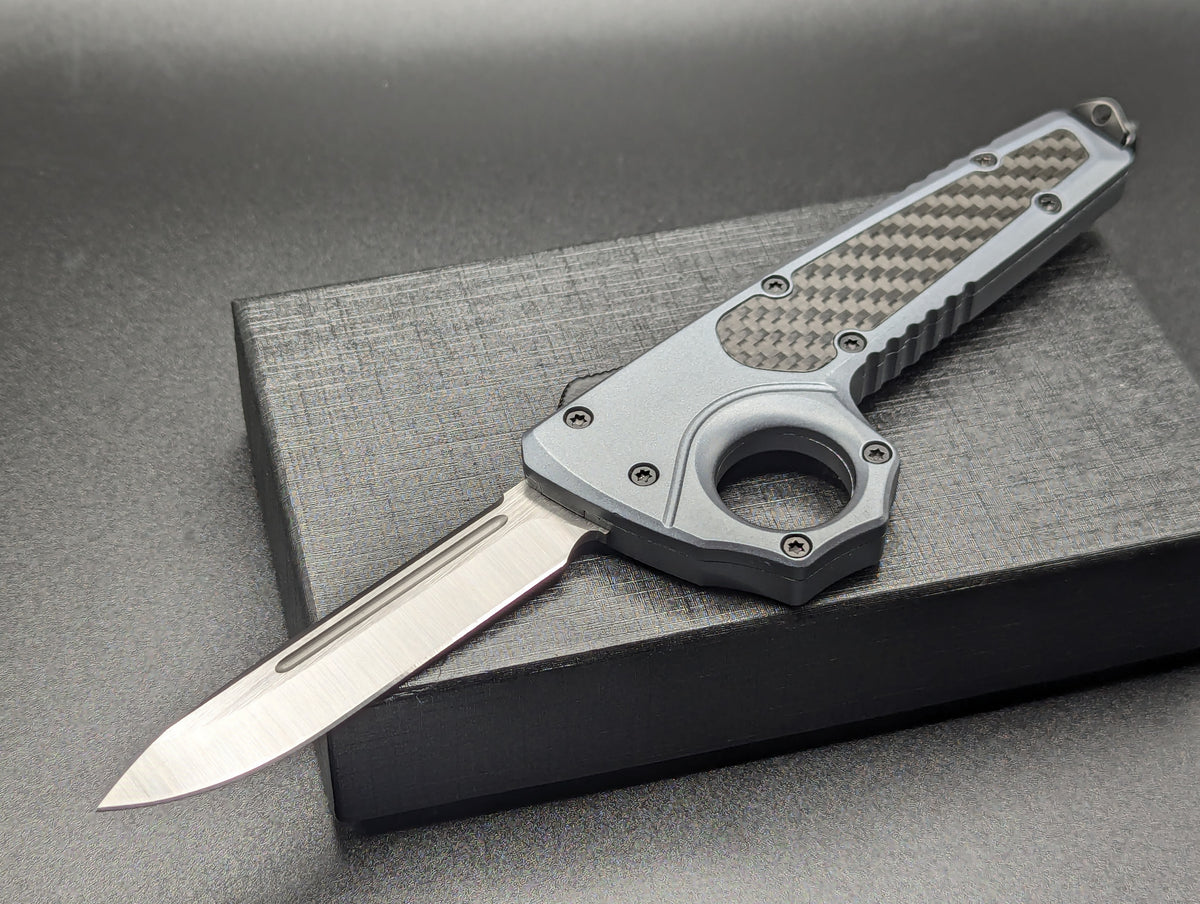 GREY SFK GLASS BREAKER D/A OTF KNIFE DROP POINT