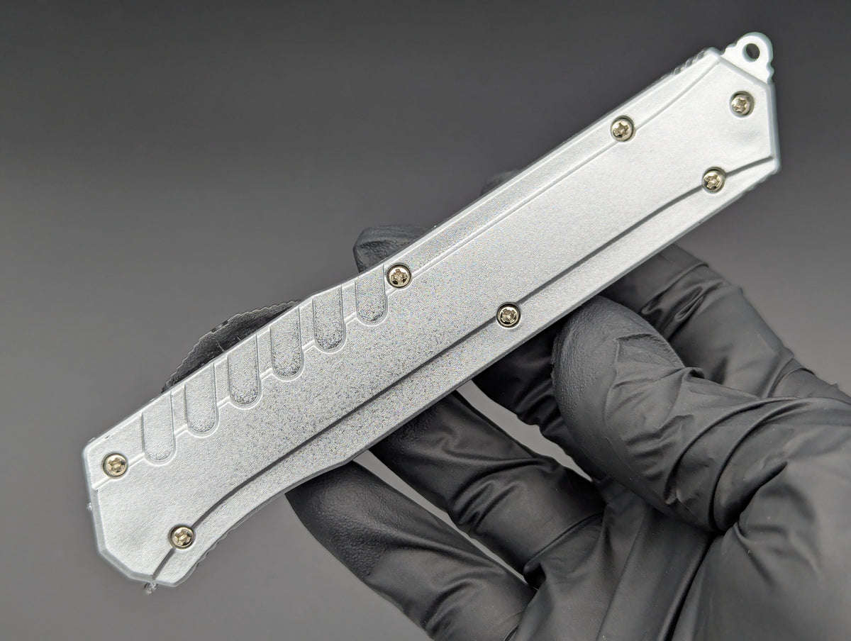 12 PC SILVER COMPOSITE D/A OTF KNIFE