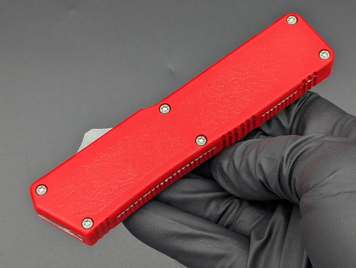 Lightning OTF Knife Red Part Serr. Drop Point